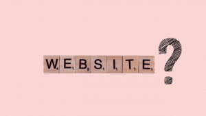 The word 'website' written in scrabble letters on a pick background